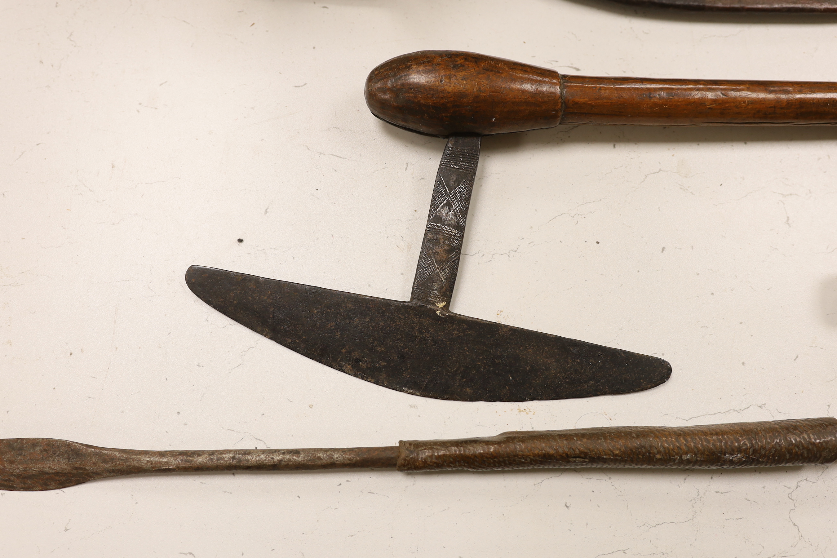 Zulu weapons and a machete, the blade stamped ‘Grape? Robert. M. Needham Sheffield’